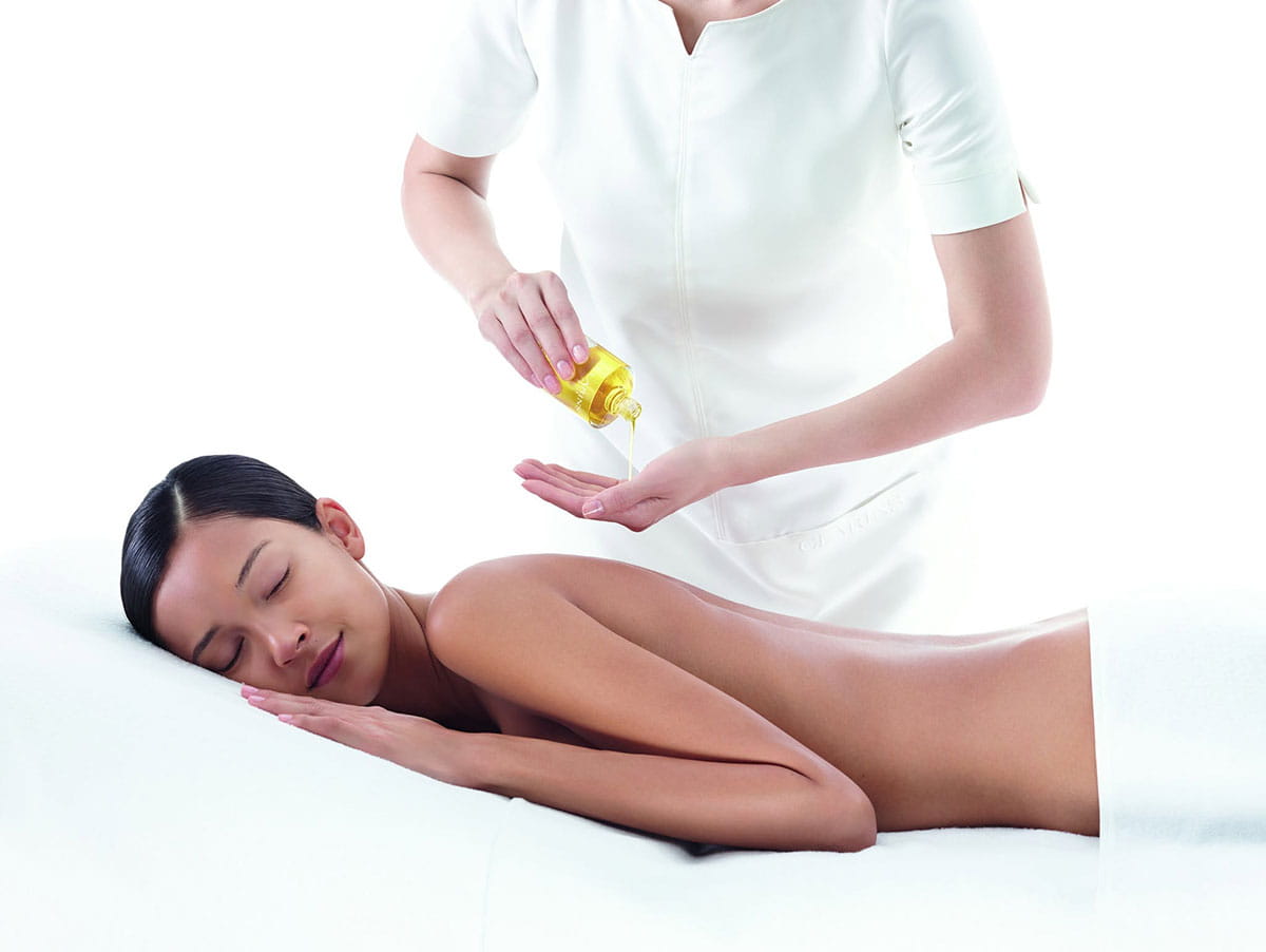 Relaxing full-body massage with aromatic oil at a professional spa and beauty salon.