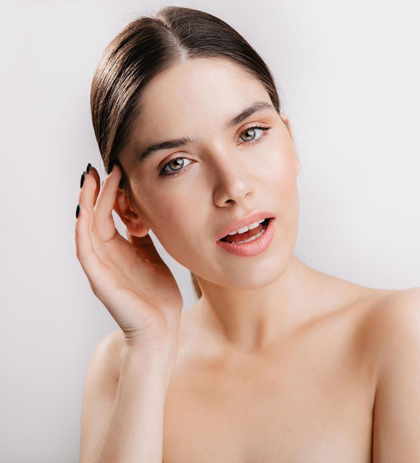 An image of a woman's face and neck.